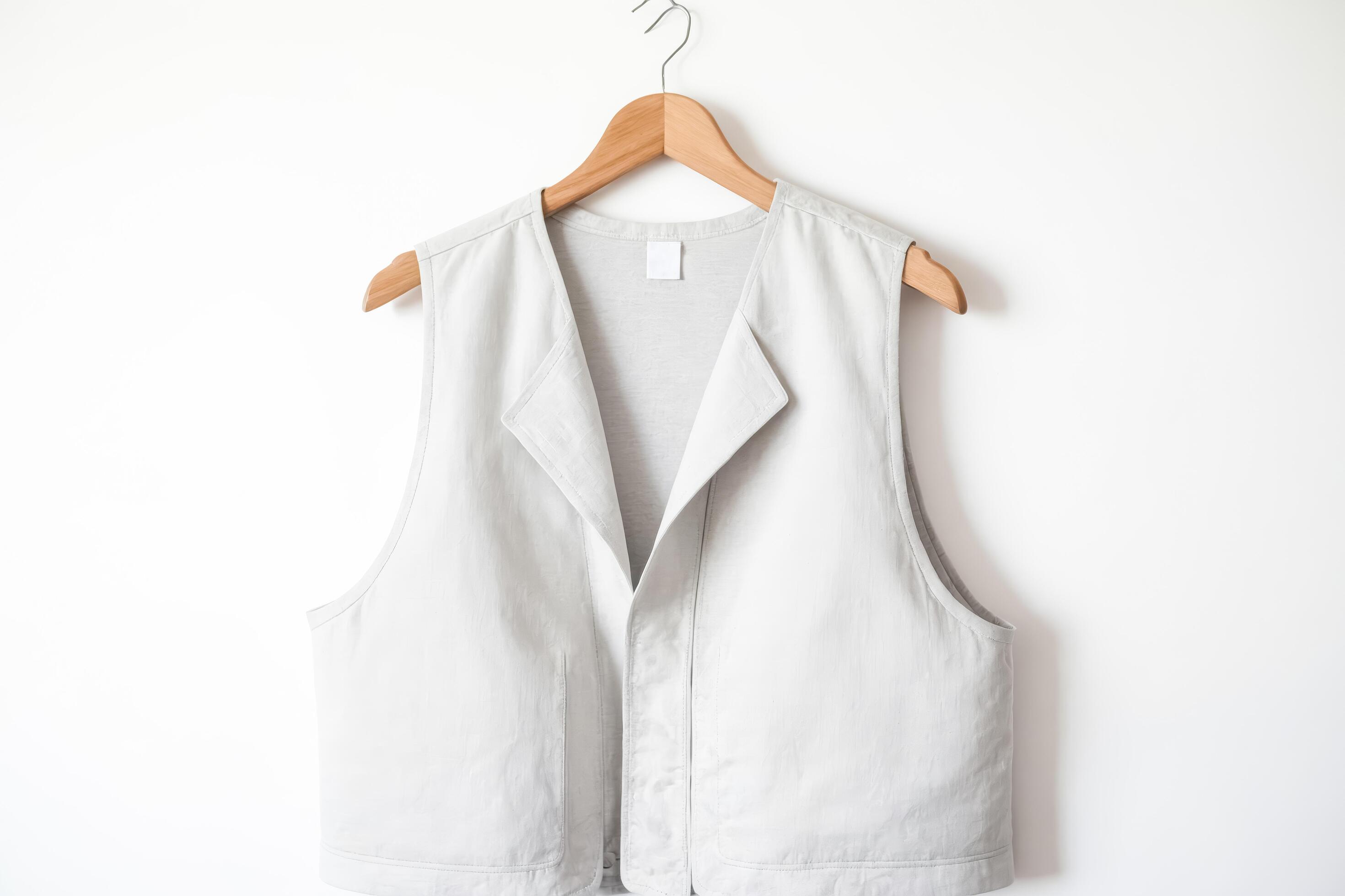 Light Gray Vest On Hanger Against White Background Stock Free