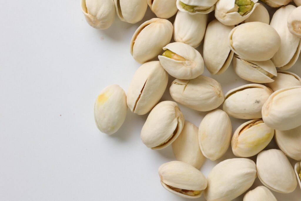 Pistachios nuts seeds on white background Stock Free