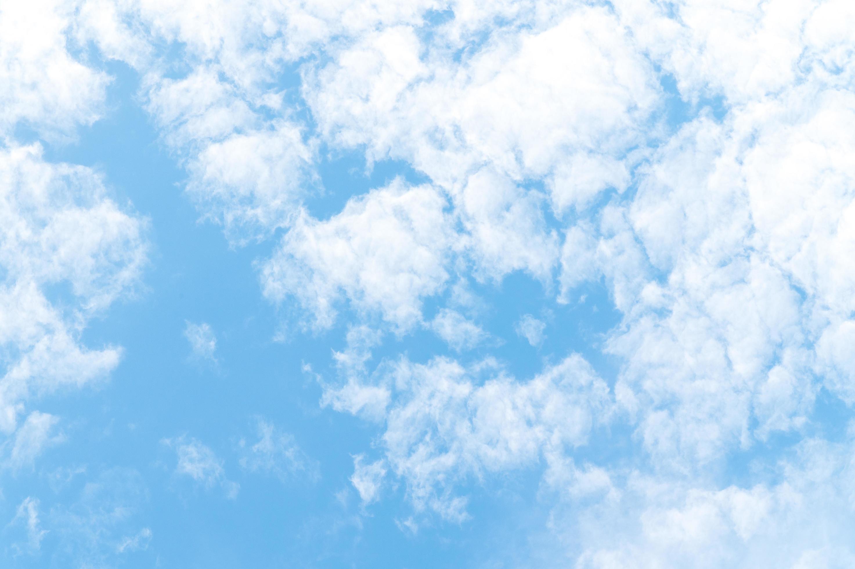 Beautiful white fluffy clouds in blue sky. Nature background from white clouds in sunny day Stock Free