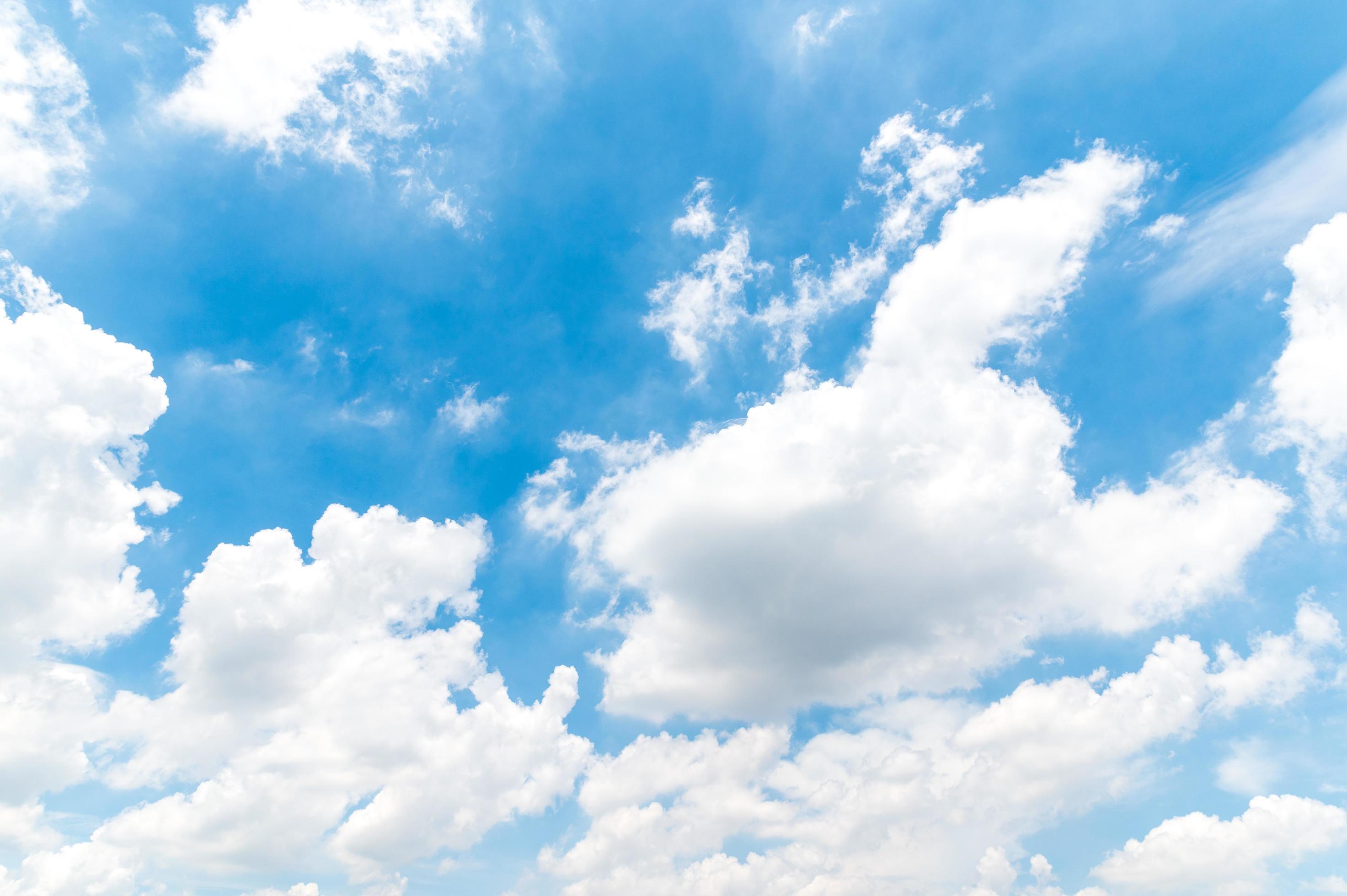 Beautiful white fluffy clouds in blue sky. Nature background from white clouds in sunny day Stock Free