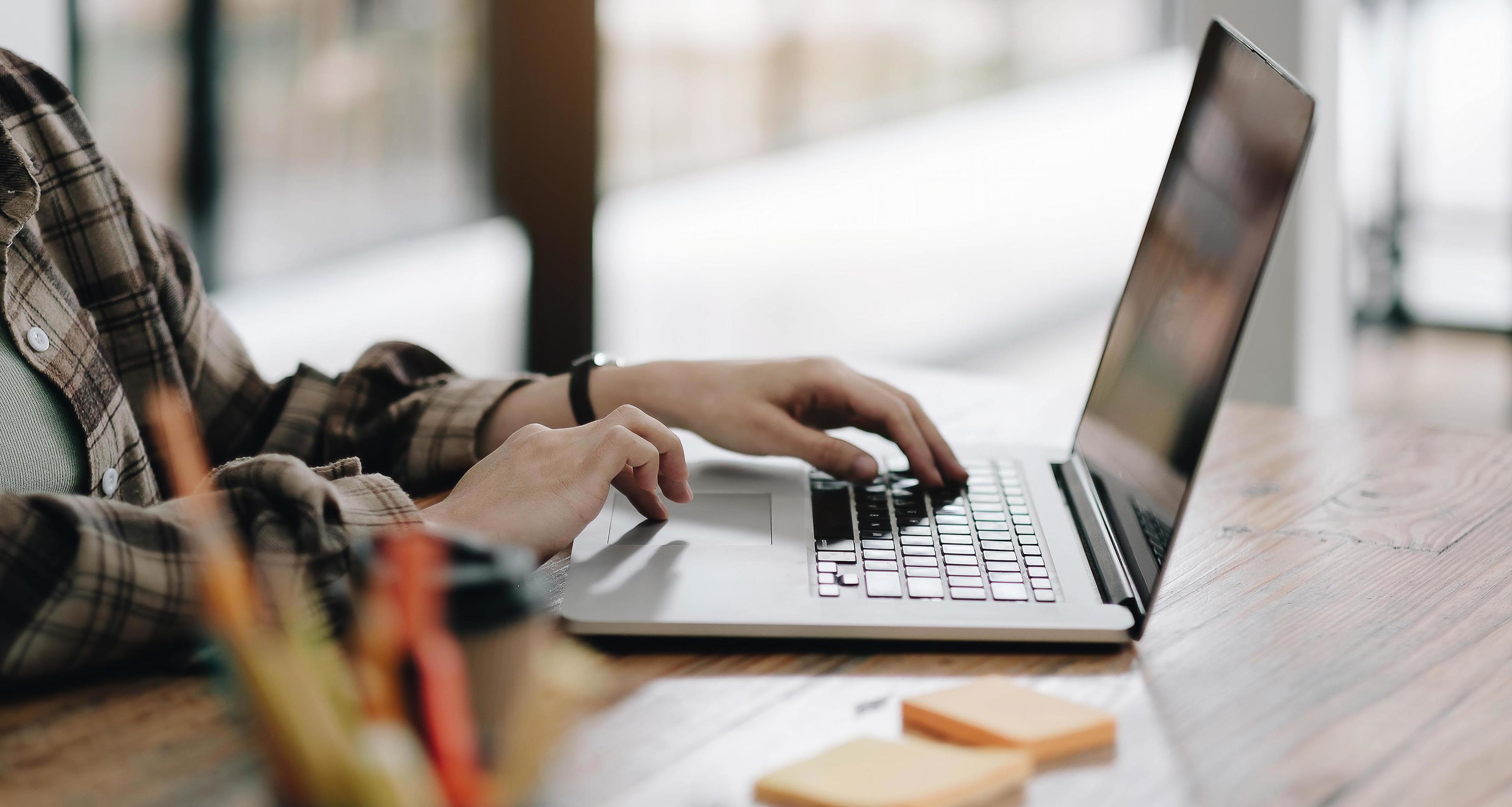 Woman working on computer, notebook, planner Stock Free