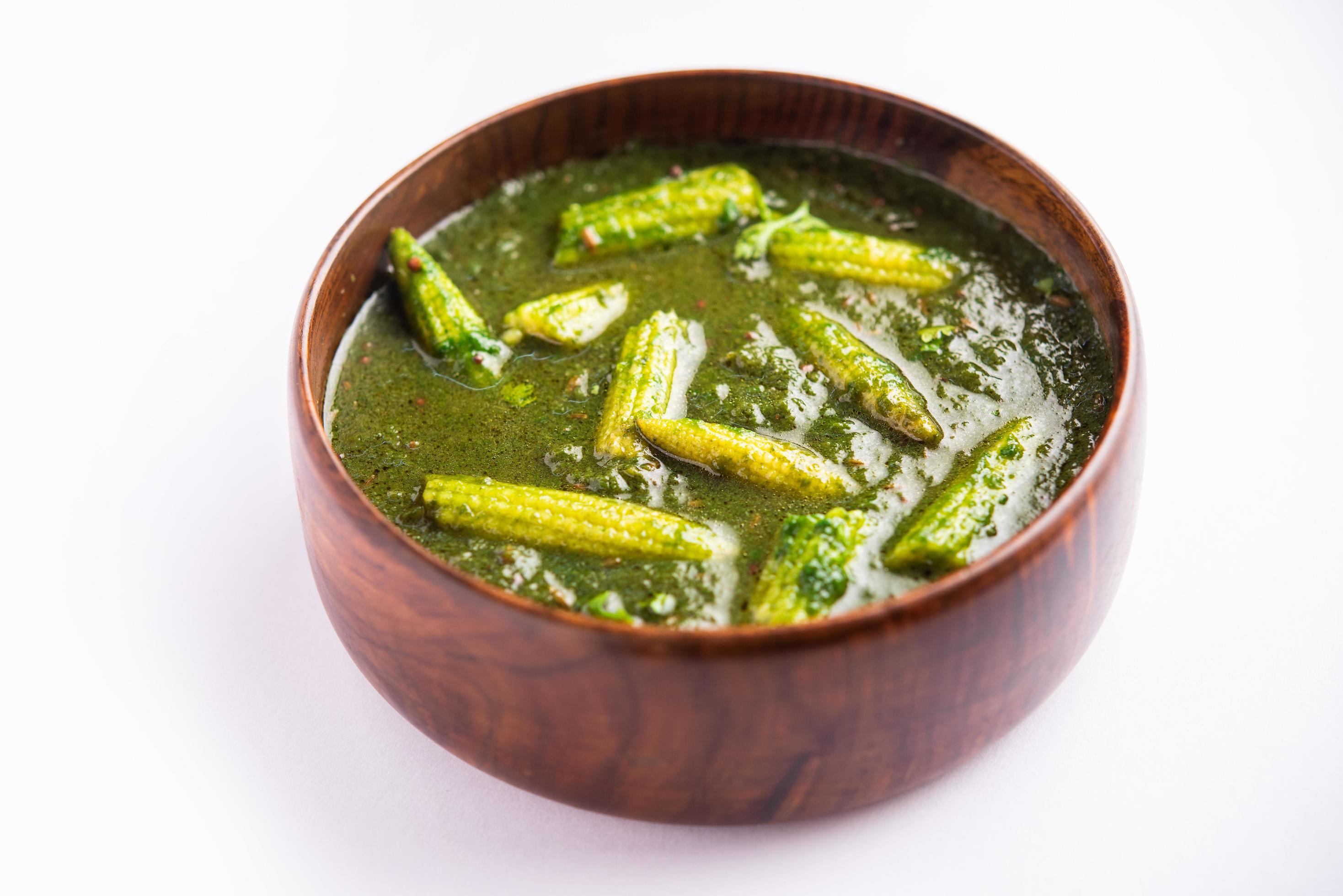 palak baby corn sabzi also known as spinach makai curry served with rice or roti, Indian food Stock Free