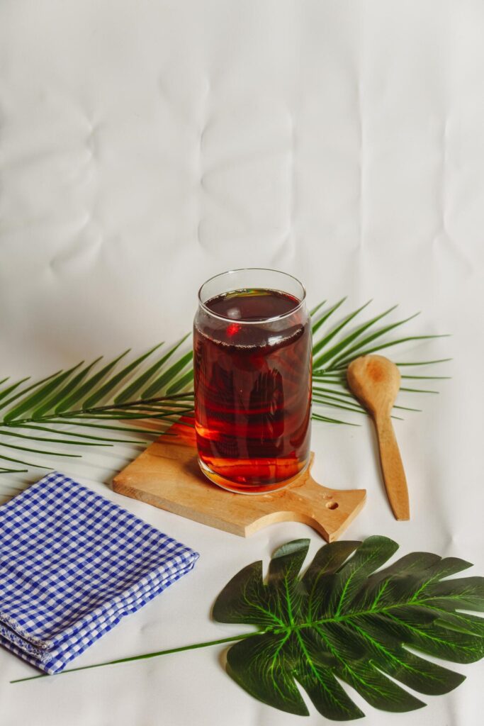 photography of a glass of tea and several elements on a white background Stock Free