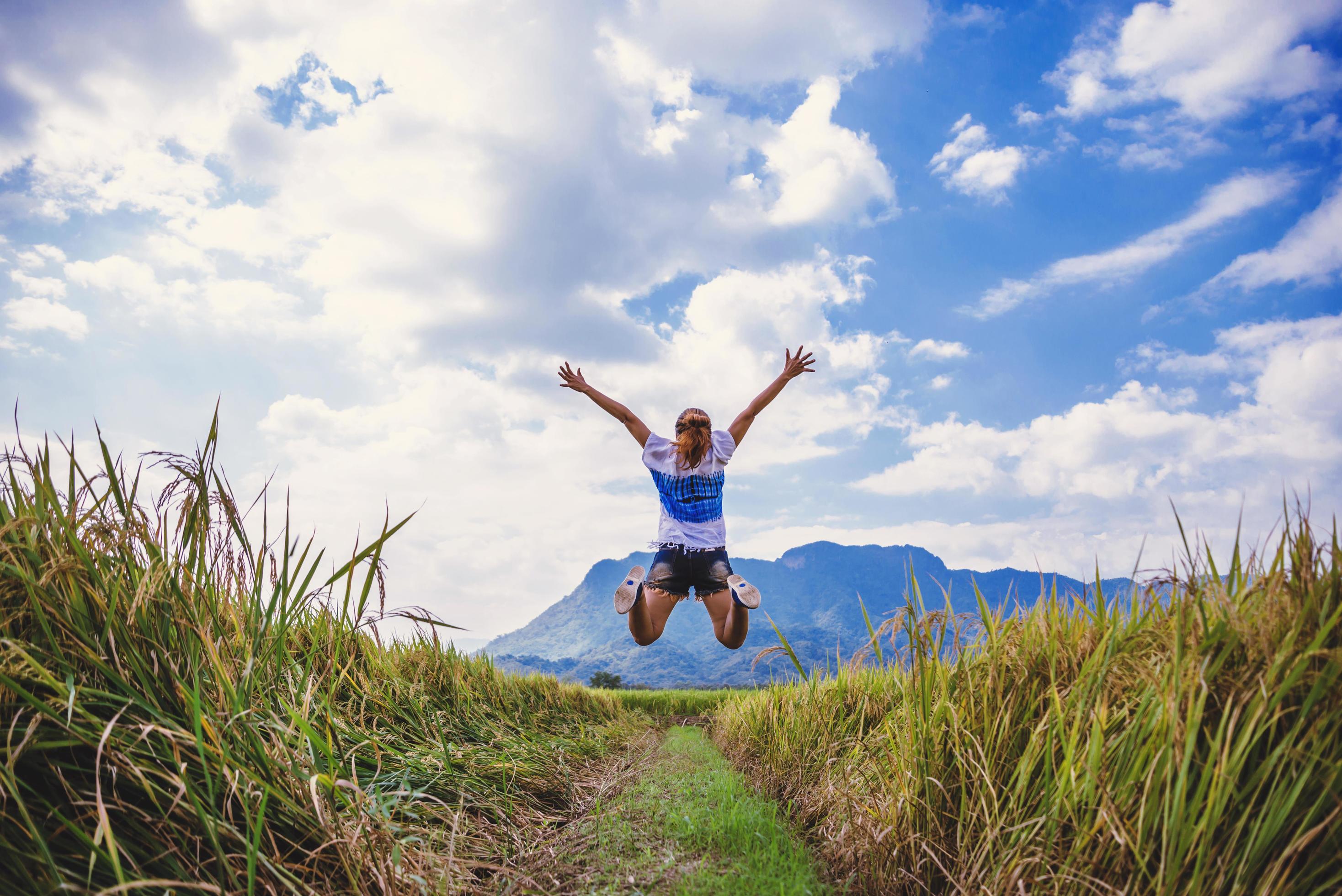 Asian women travel relax in the holiday. Stand natural touch mountain field. Jump stand glad middle field rice. Thailand Stock Free