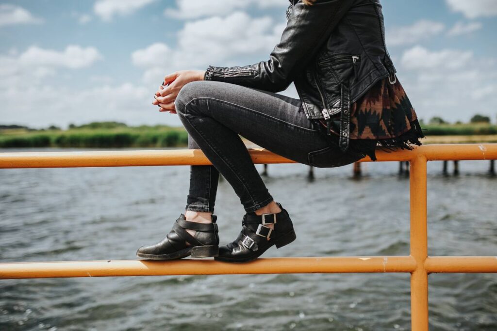 Beautiful blonde woman on a wooden pier by the lake Stock Free