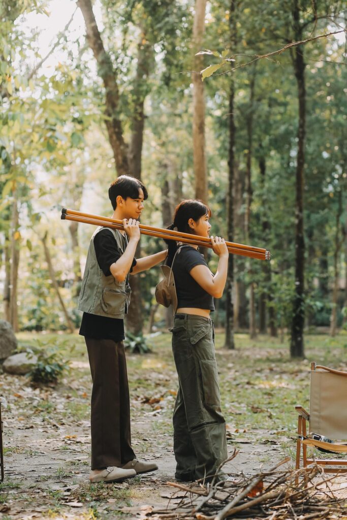 Asian couple sweet in tent inside on they camping trip, traveller relax and sleep togather in out door and camping trip Stock Free