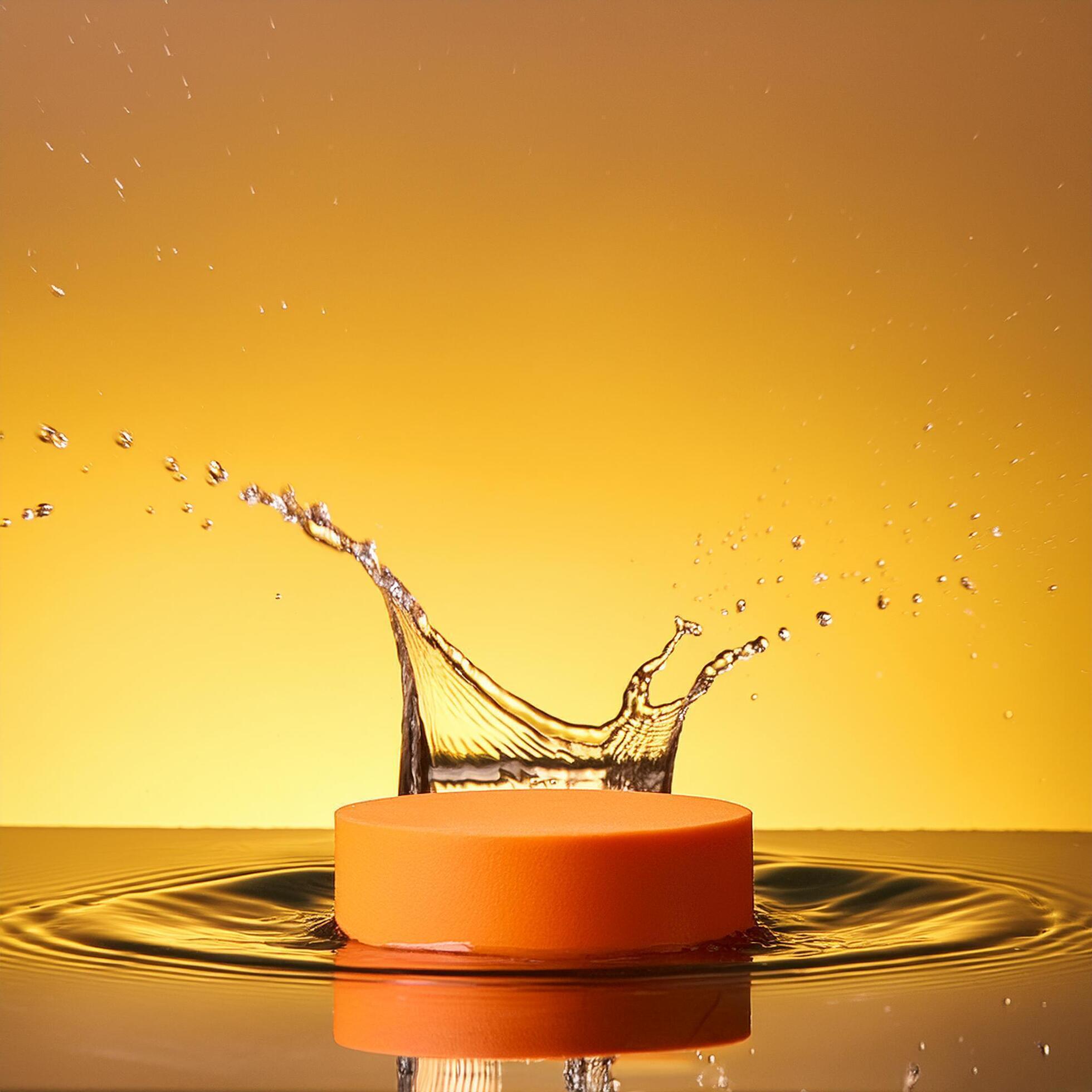 empty orange podium mockup with water splash on a gradient background for product display Stock Free