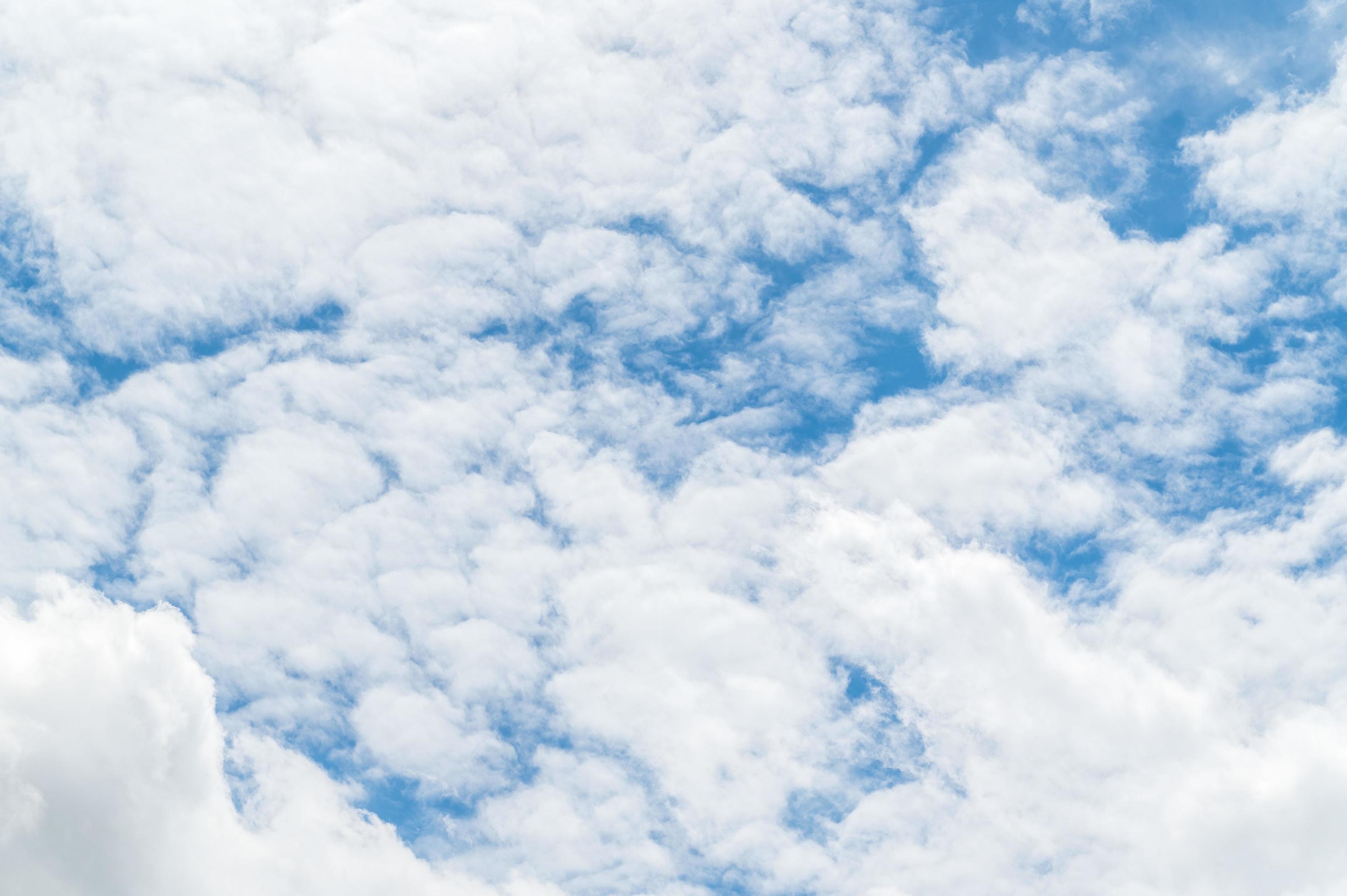 Beautiful white fluffy clouds in blue sky. Nature background from white clouds in sunny day Stock Free