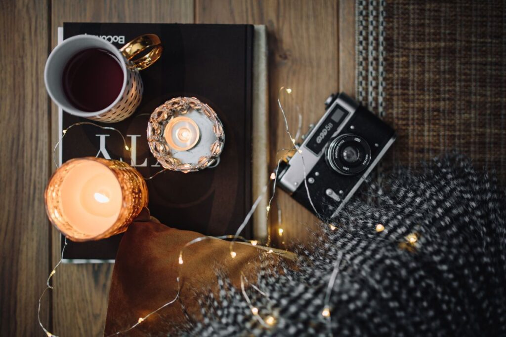 Old camera, mug with tea and books Stock Free