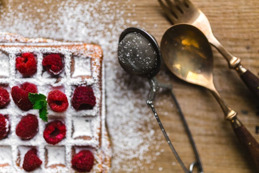 Breakfast waffles with fresh raspberries and powdered sugar Stock Free