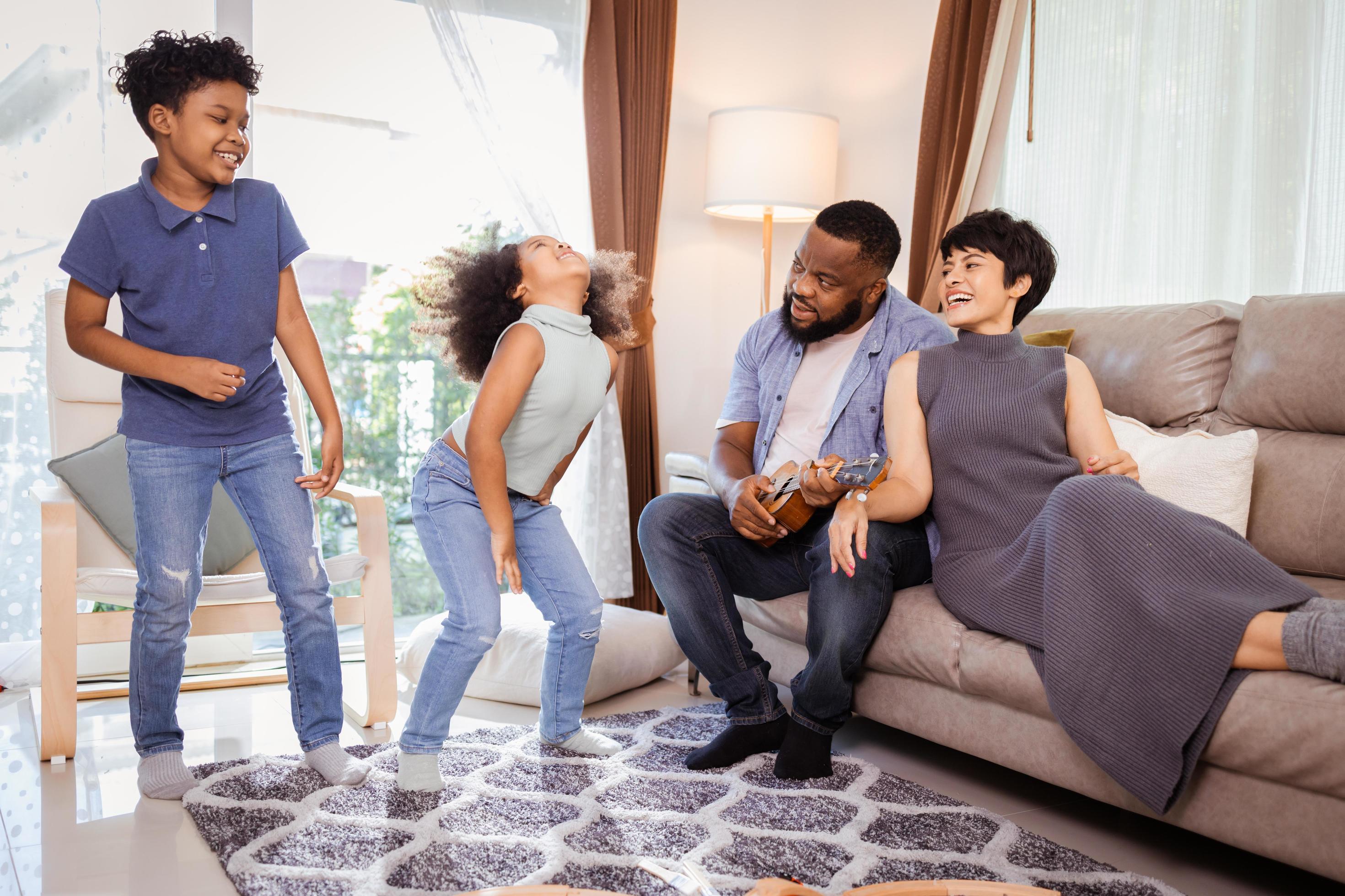 Happy African American family spending time together concept. African American family home activity Stock Free