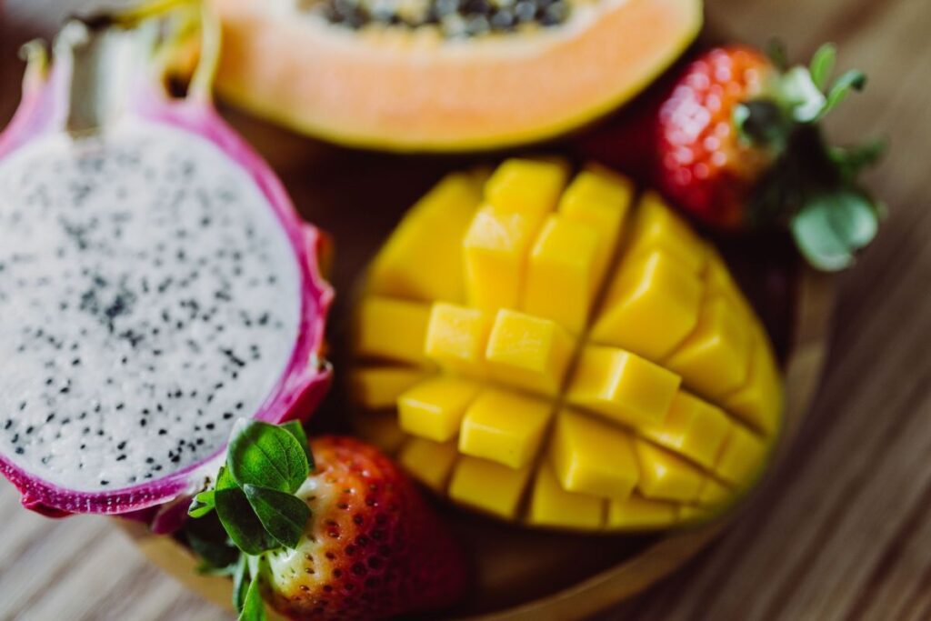 Exotic fruits on a wooden table Stock Free