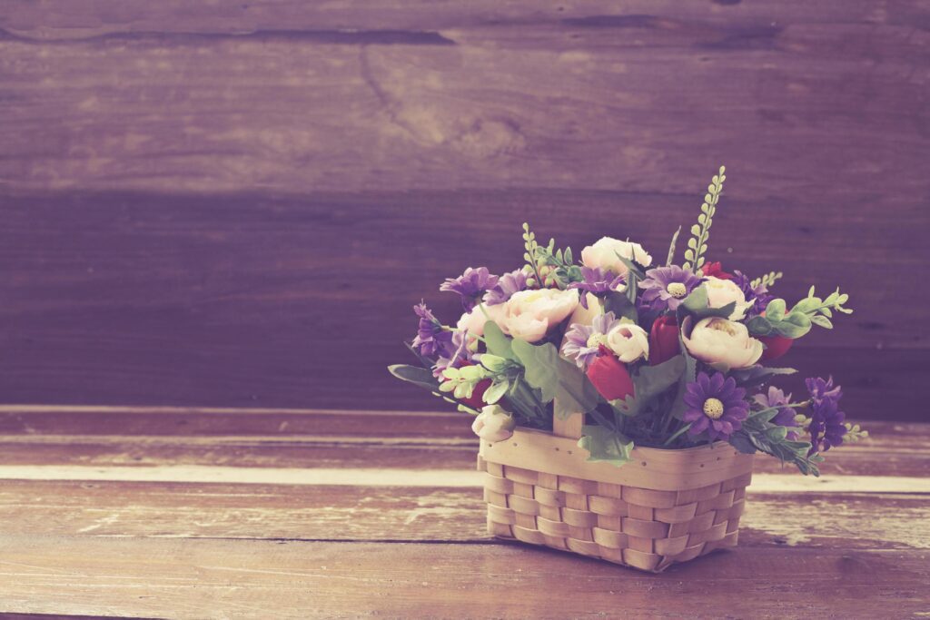 still life flower in basket on old wood Stock Free