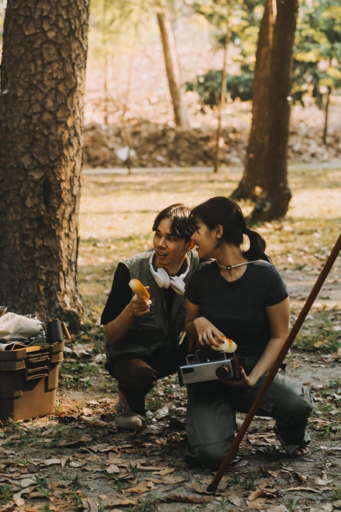 Asian couple sweet in tent inside on they camping trip, traveller relax and sleep togather in out door and camping trip Stock Free