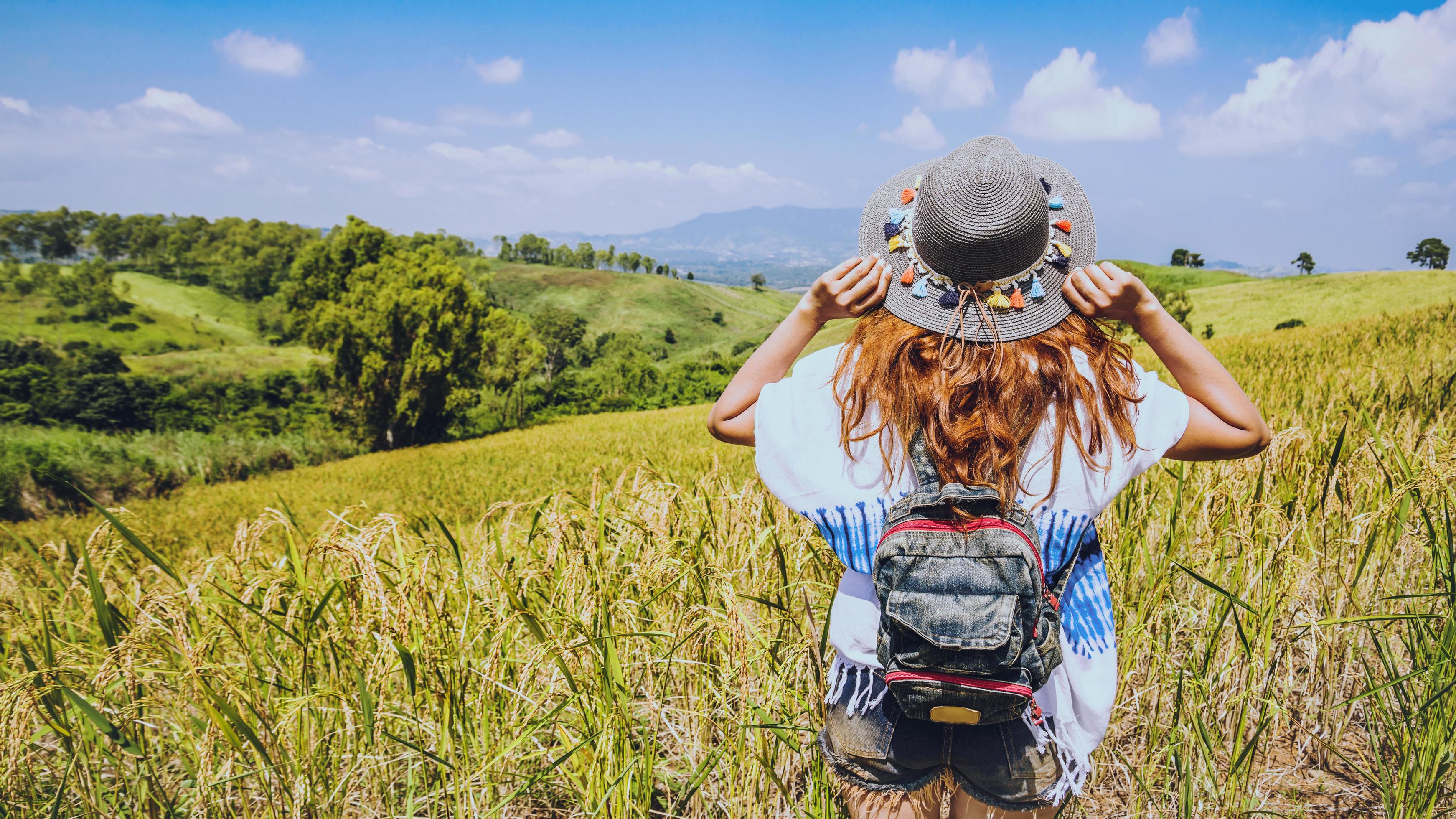 Asian women travel relax in the holiday. Stand natural touch mountain field. Thailand Stock Free