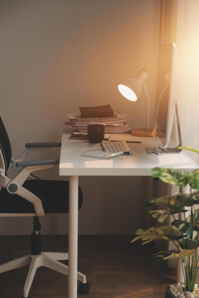 messy office workspace. Messy and cluttered office desk. Messy business office with piles of files and disorganized clutter. Stock Free