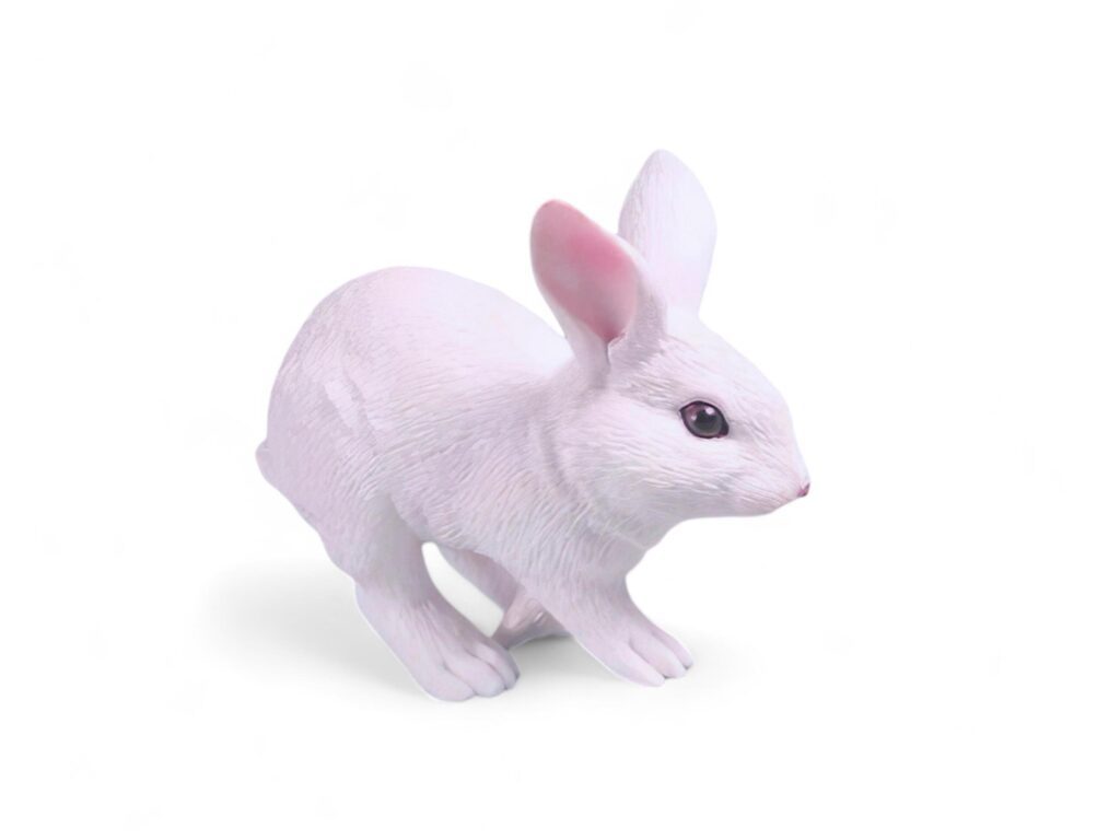 Miniatur of white rabbit on white background Stock Free