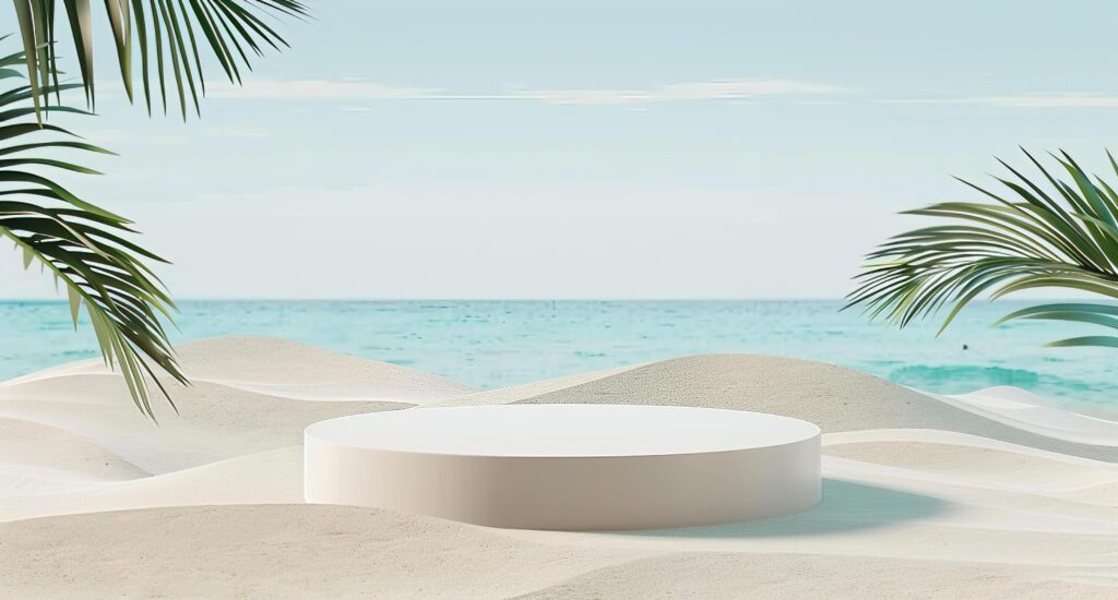 White Circular Pedestal on Sand with an Ocean Background Stock Free