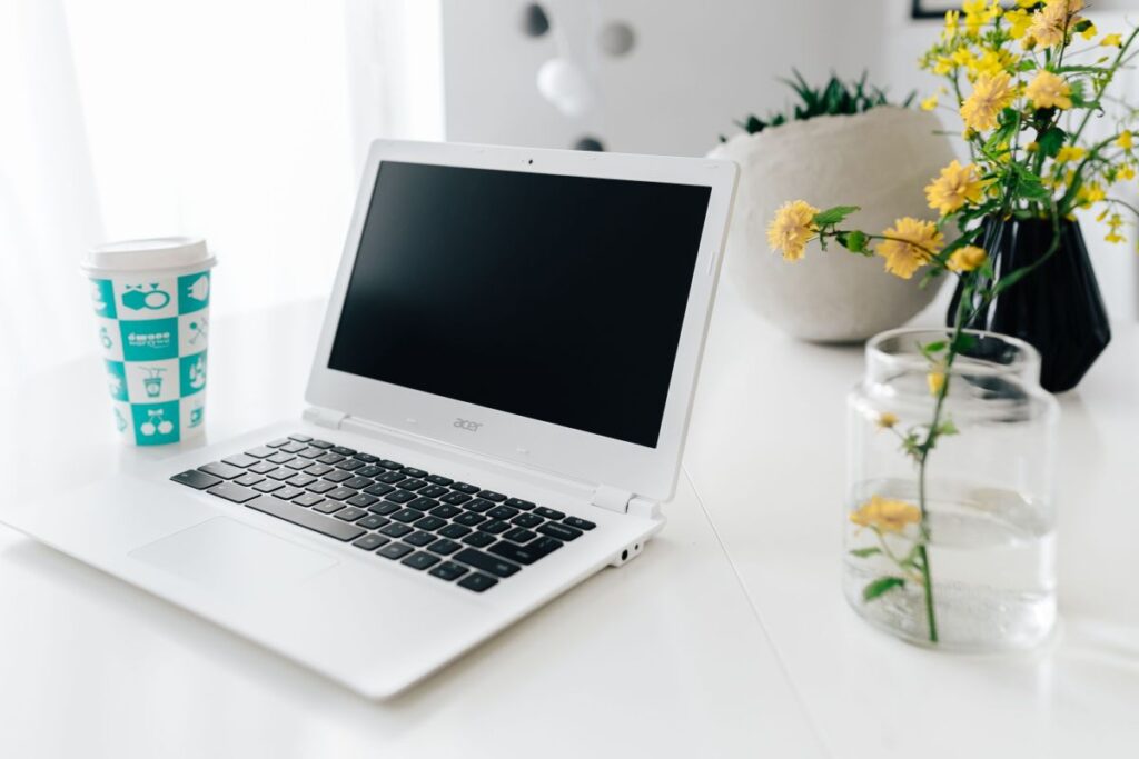 Workplace with laptop on table at home Stock Free