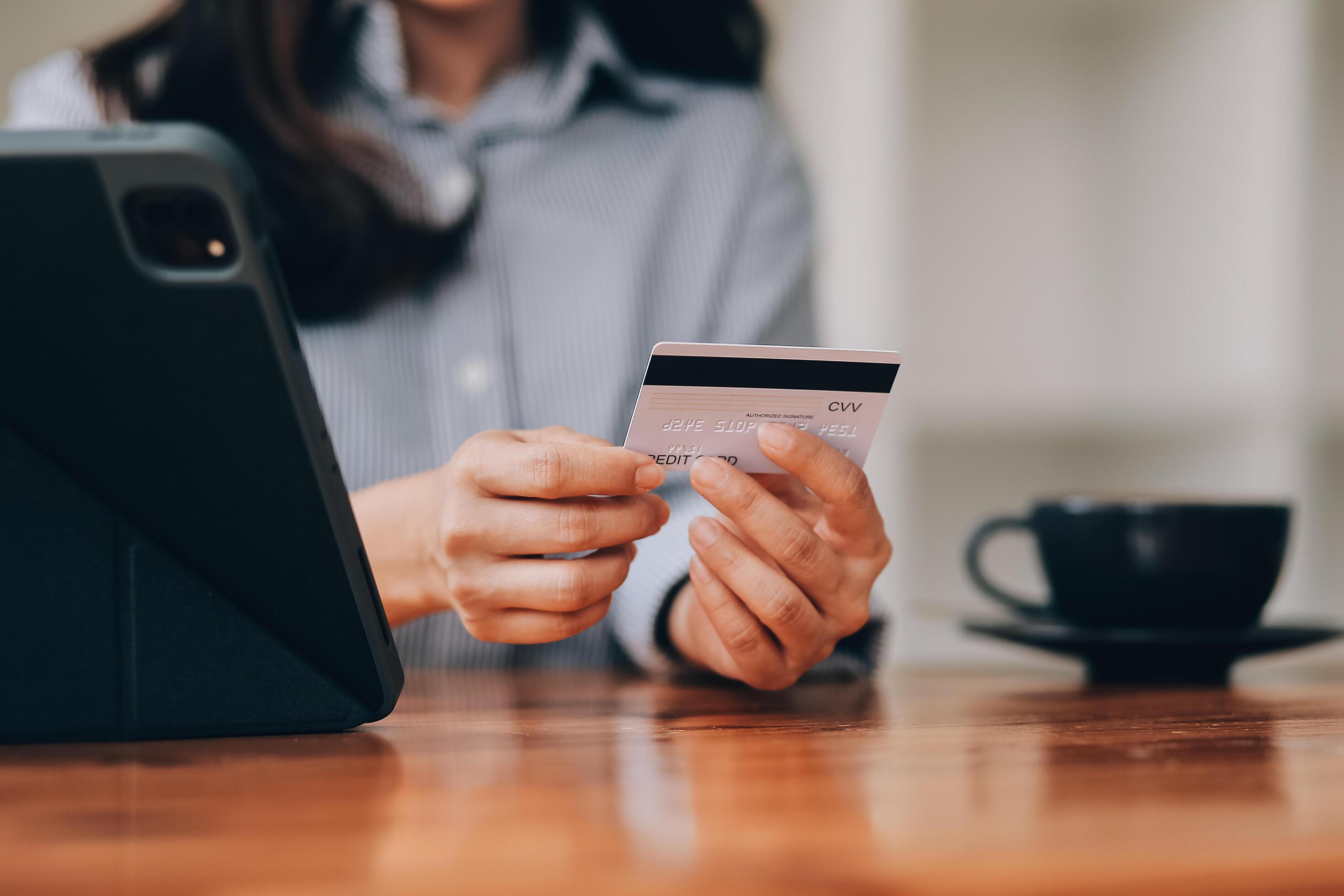 Happy asian woman using smartphone shopping online with credit card. Lifestyle. Easy pay using smart phone or digital device. Stock Free