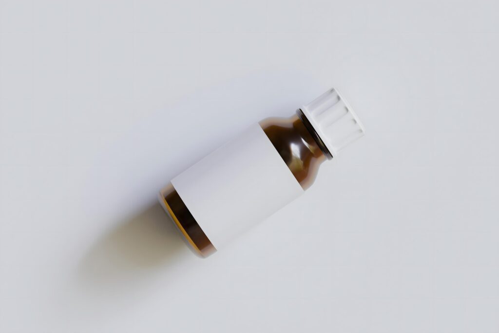 Packaging bottle brown color and white blank label for medicine, pill or supplement, cosmetic, chemical and etc on white background Stock Free