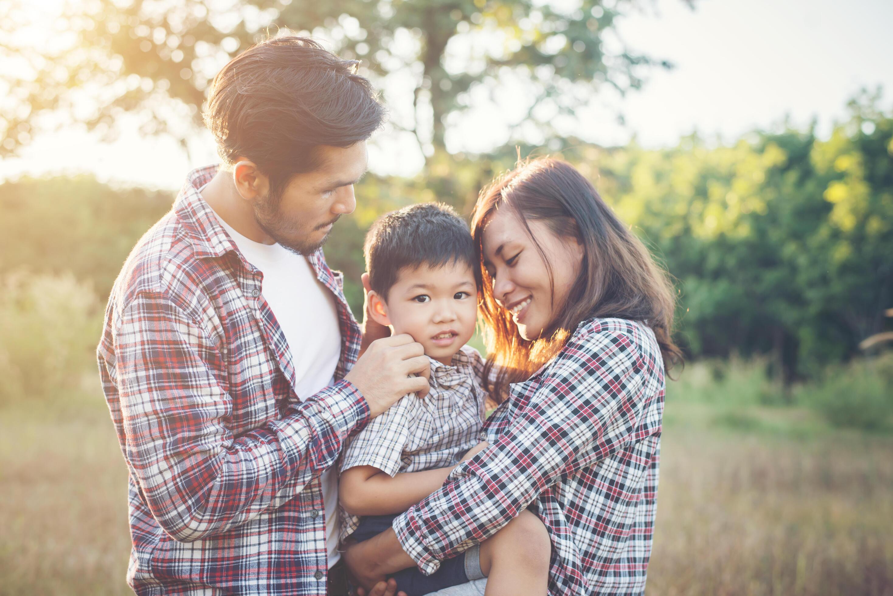 Happy young family spending time together outside. Family love concept Stock Free