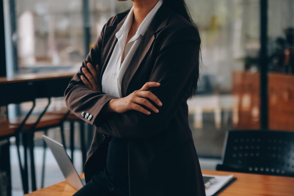 Asian Businesswoman working on laptop at the office with documents on his desk, doing planning analyzing the financial report, business plan investment, finance analysis concept Stock Free