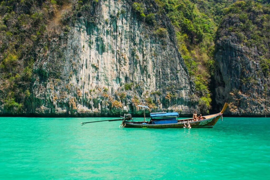 Brown & Blue Boat Near Cliff Stock Free