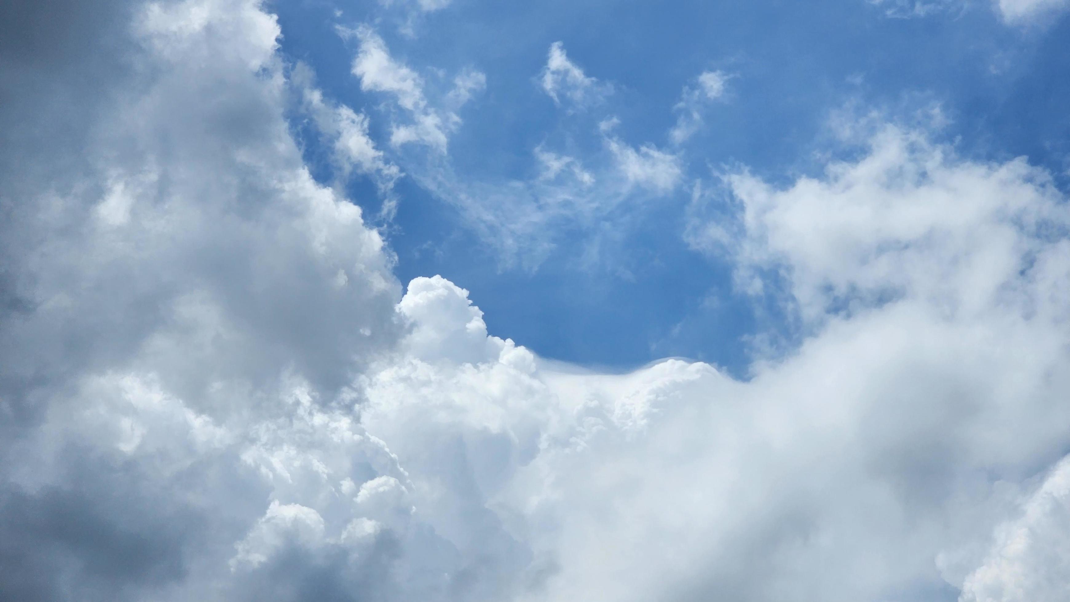 Cumulus Clouds In A Blue Sky During Day Time. Natural Sky Background and Wallpaper Stock Free