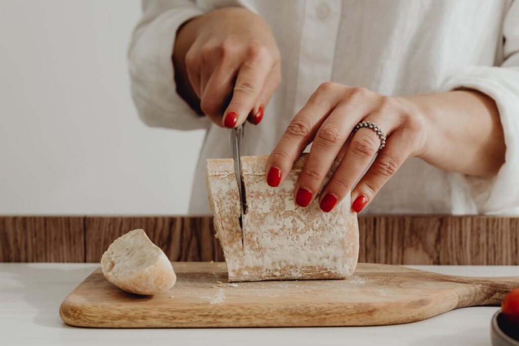 Woman making bruschetta with healthy ingredients Stock Free