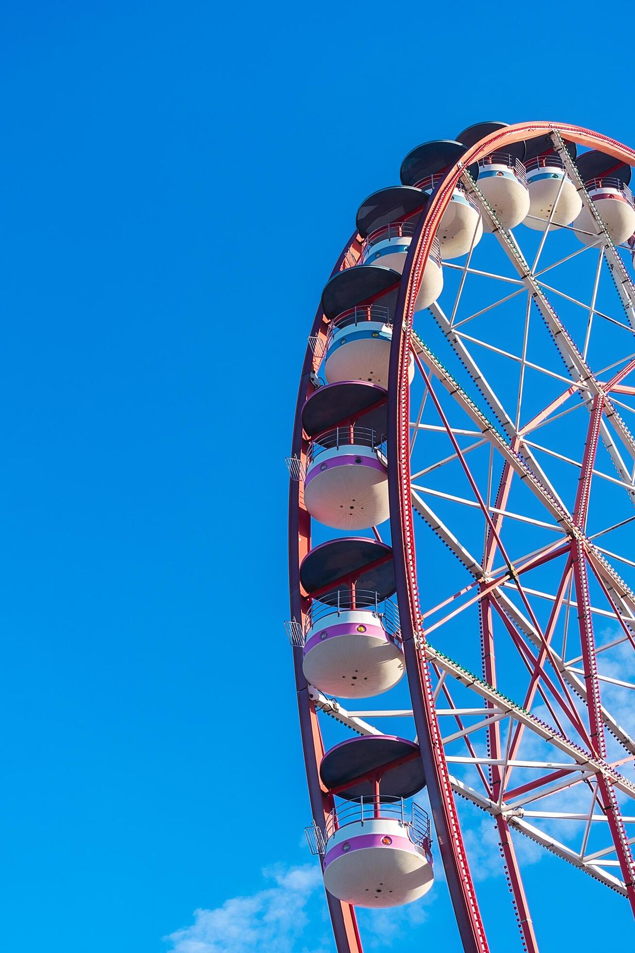 View of the Ferris wheel attraction against a background of blue sky. Ferris wheel in the Georgian city of Batumi. Stock Free