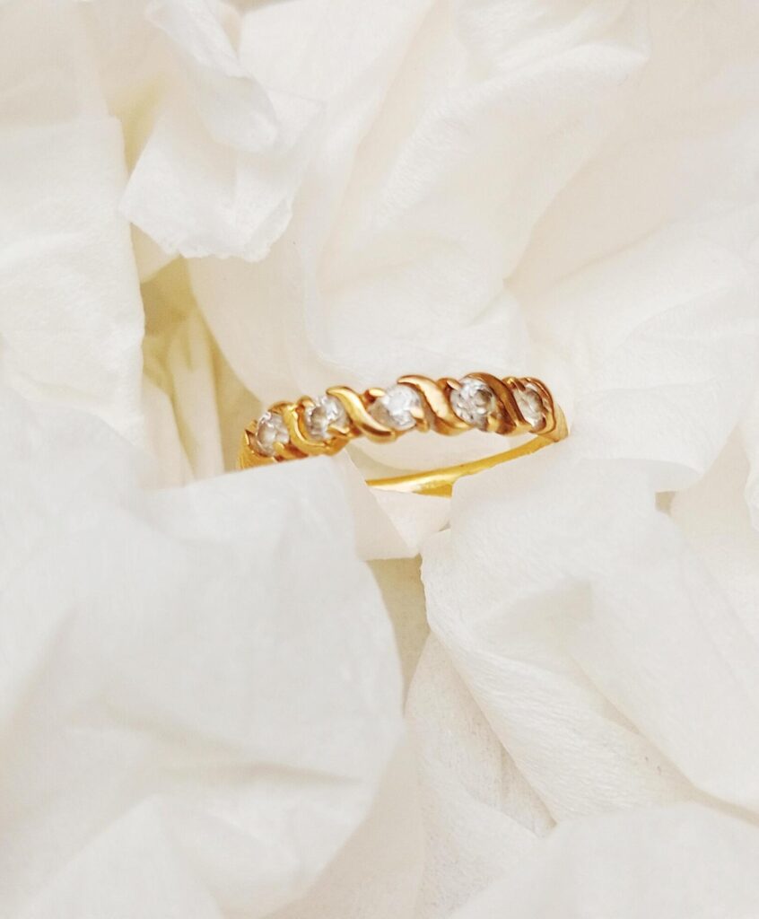 a gold ring on a white background Stock Free