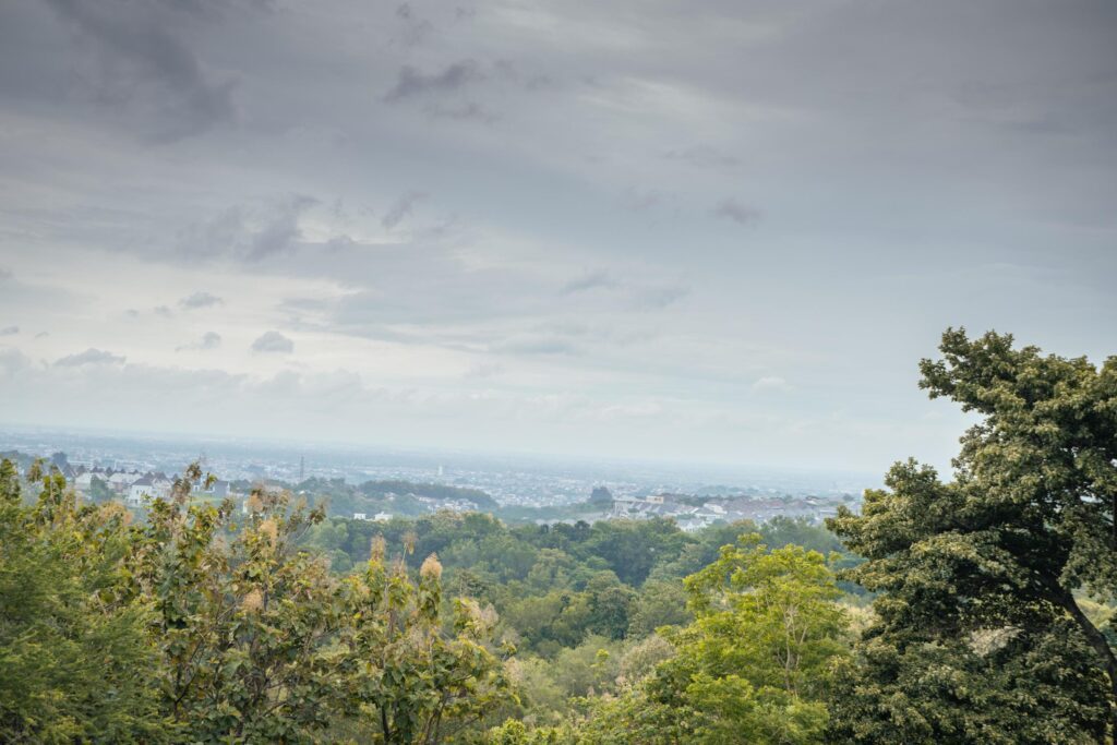 Landscape of hilltop with cloudy vibes when rain season. The photo is suitable to use for environment background, nature poster and nature content media. Stock Free