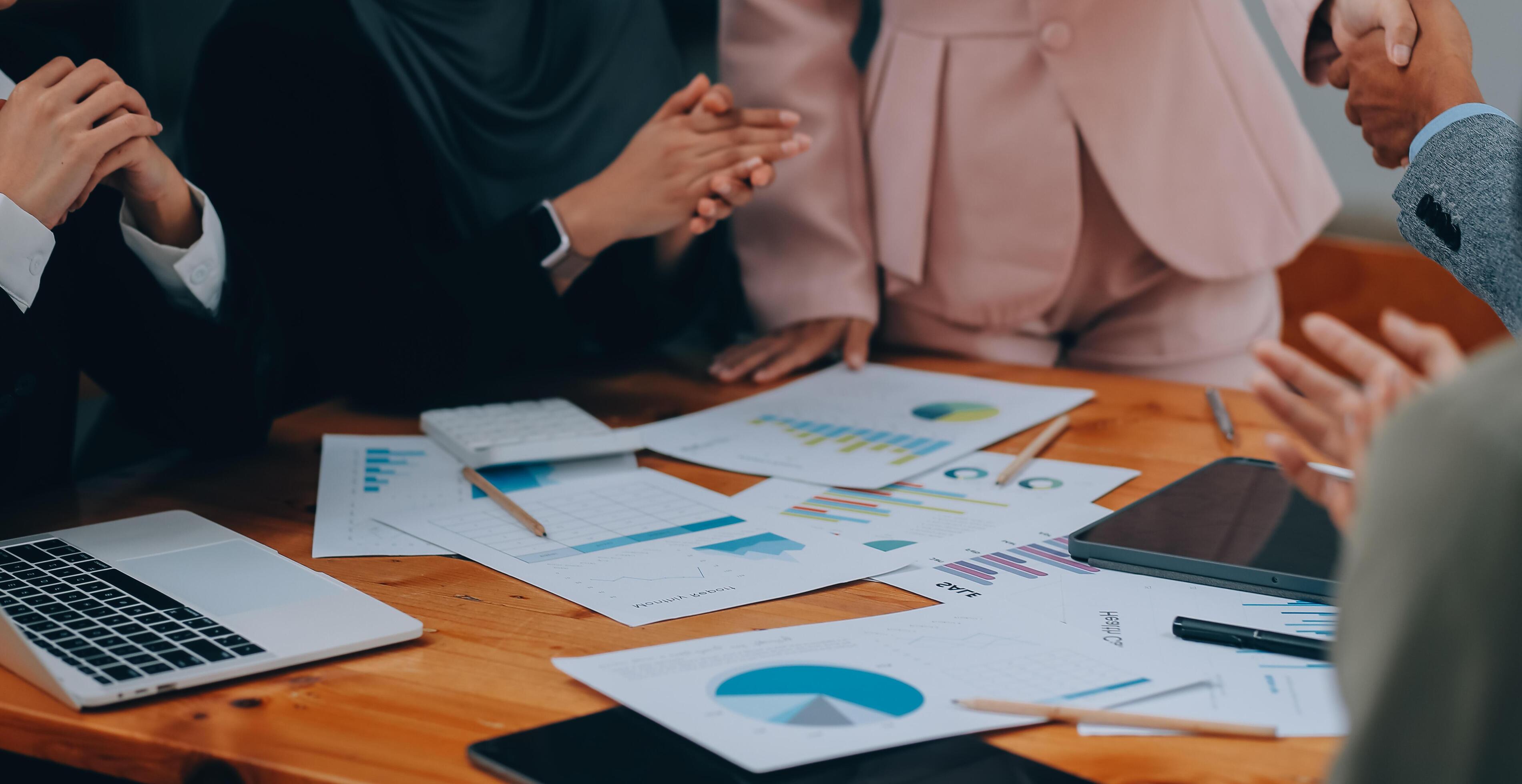 Businesswoman partnership handshake concept. Two young asian business professionals celebrating teamwork in an office, Colleague in meeting. Stock Free