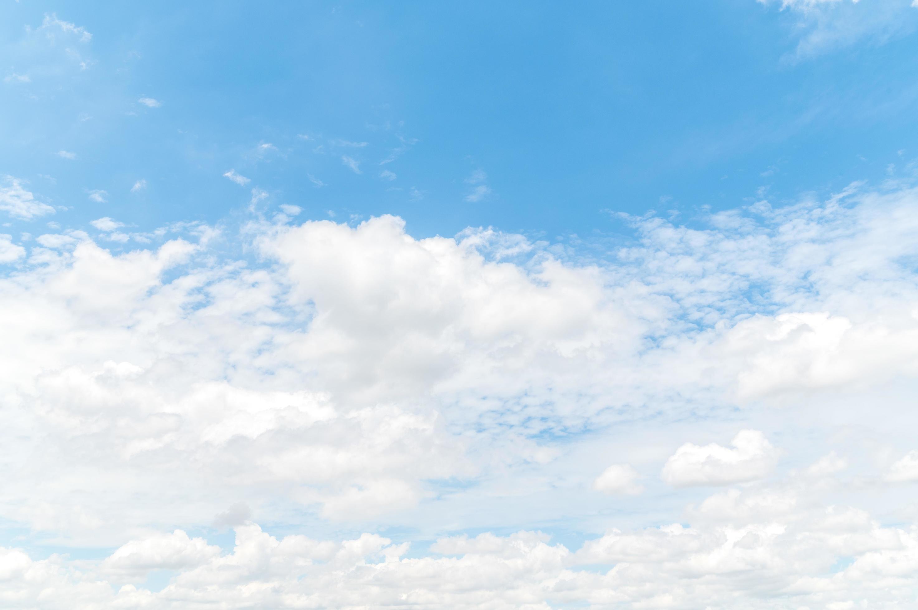 Beautiful white fluffy clouds in blue sky. Nature background from white clouds in sunny day Stock Free