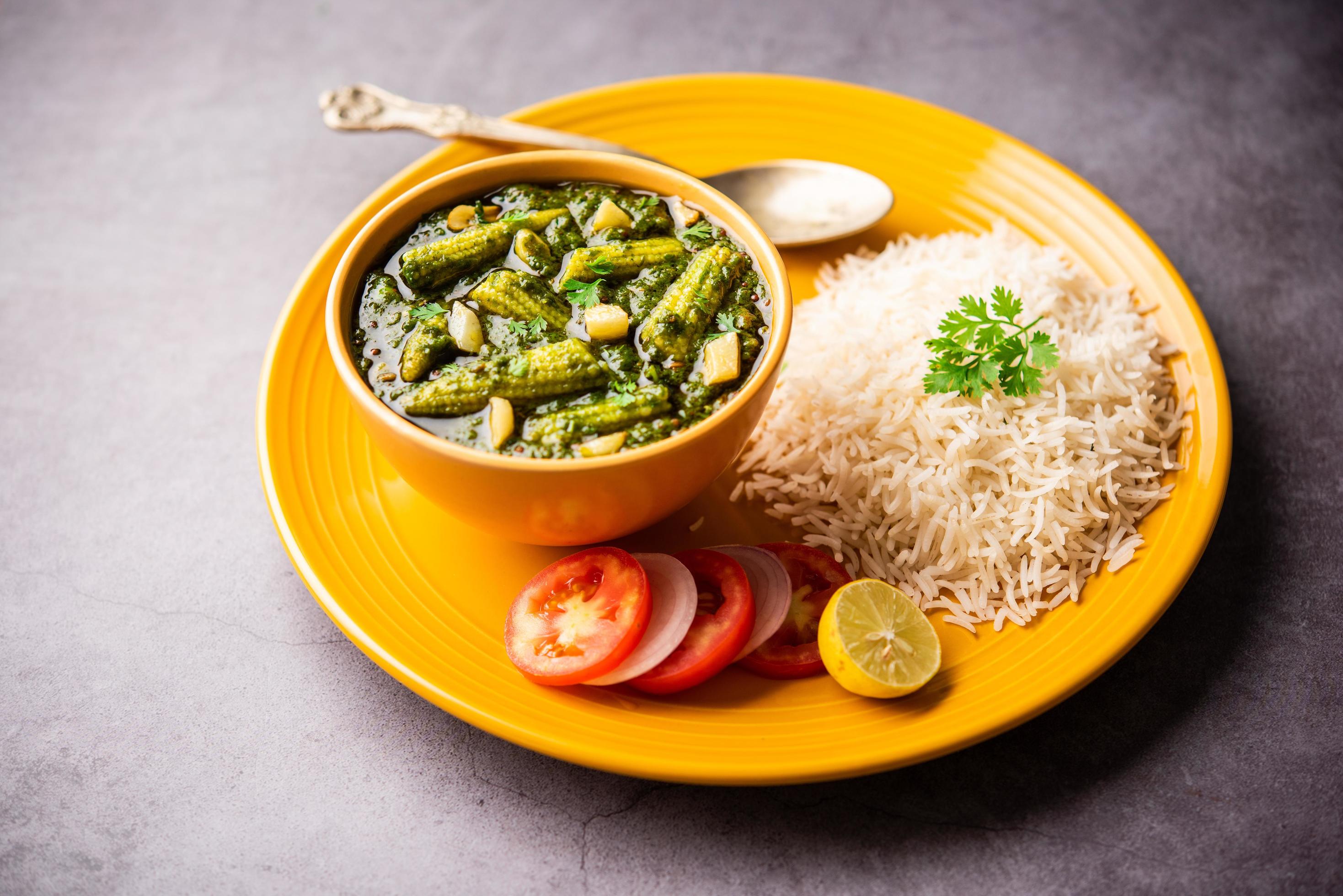 palak baby corn sabzi also known as spinach makai curry served with rice or roti, Indian food Stock Free