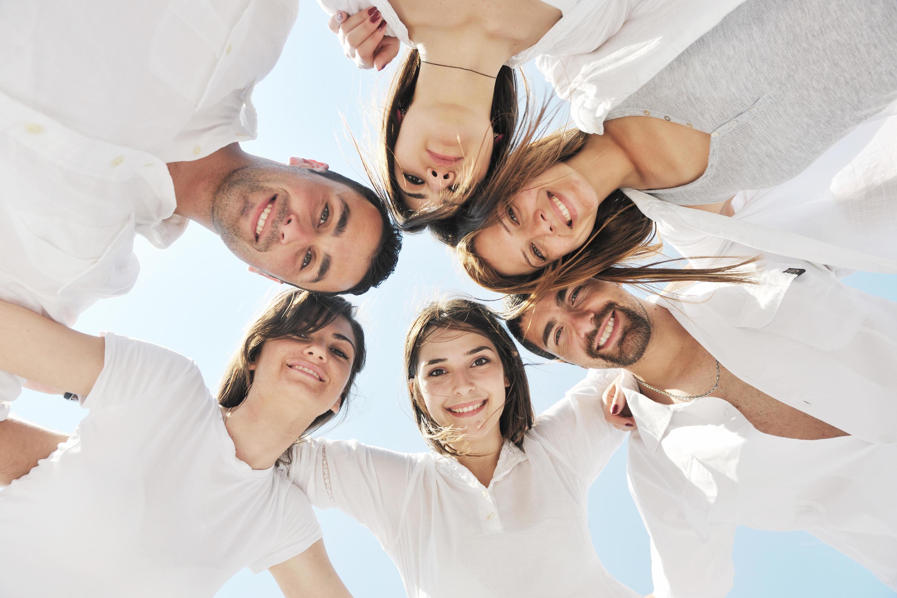 Group of happy young people in have fun at beach Stock Free