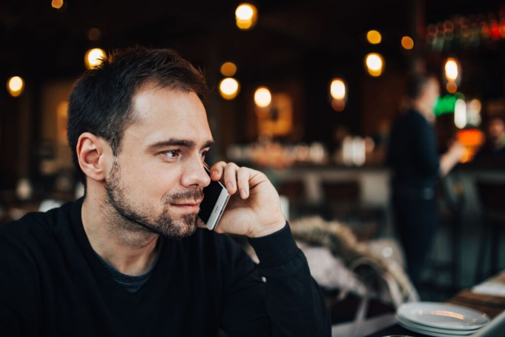 Young Entrepreneur Working from a Modern Cafe Stock Free