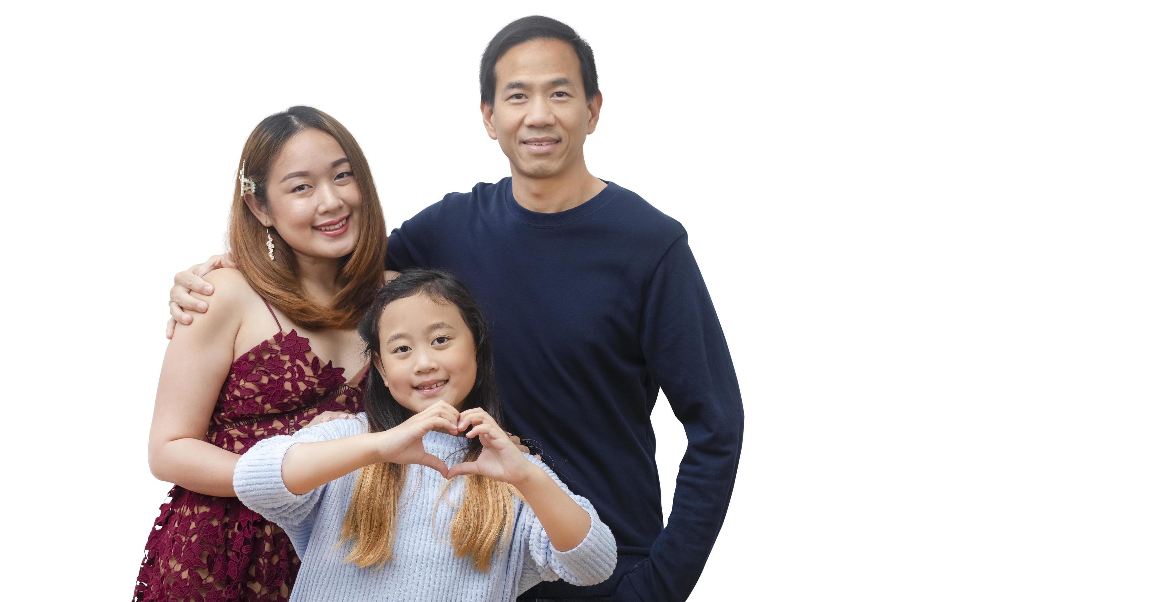 Asian family woman and a man with little junior woman smiling and fun isolated over white background Stock Free