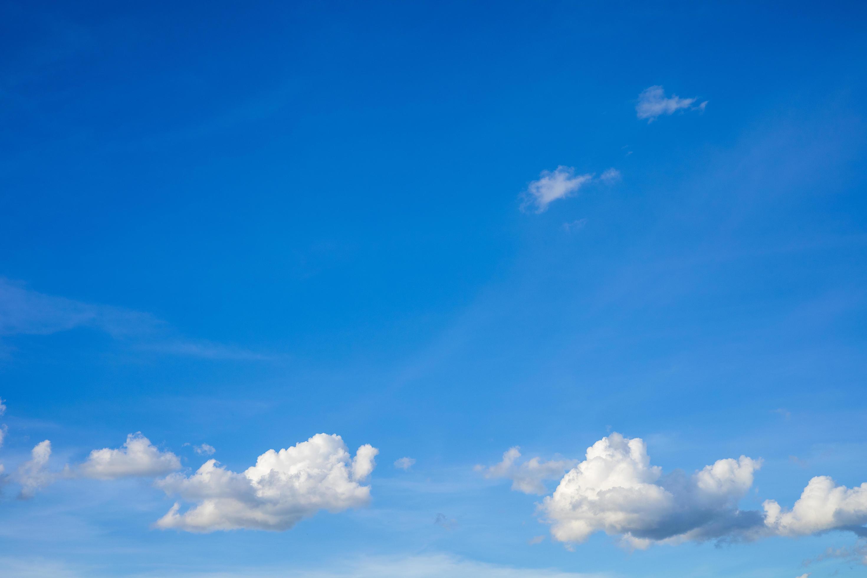 Beautiful bright blue sky with white clouds, nature background concept. Stock Free