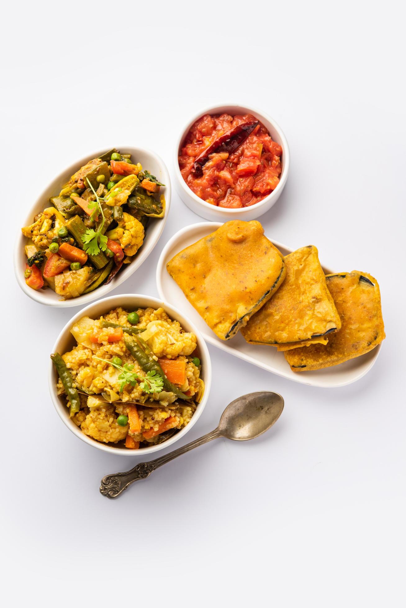 Bengali Bhog food for Indian Hindu Durga Puja or pooja festival. Khichadi, labra, tomato chutney Stock Free