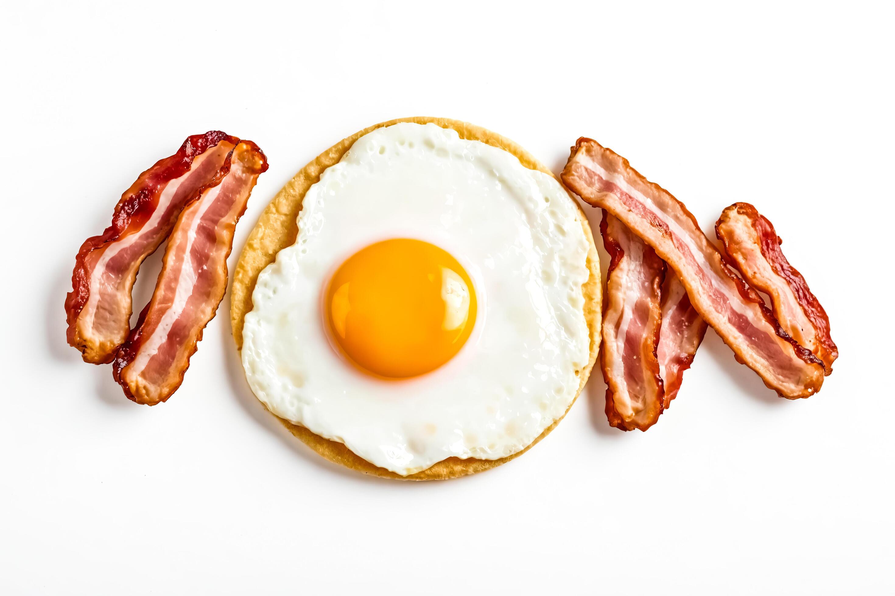 Fried Egg with Crispy Bacon on White Background Stock Free