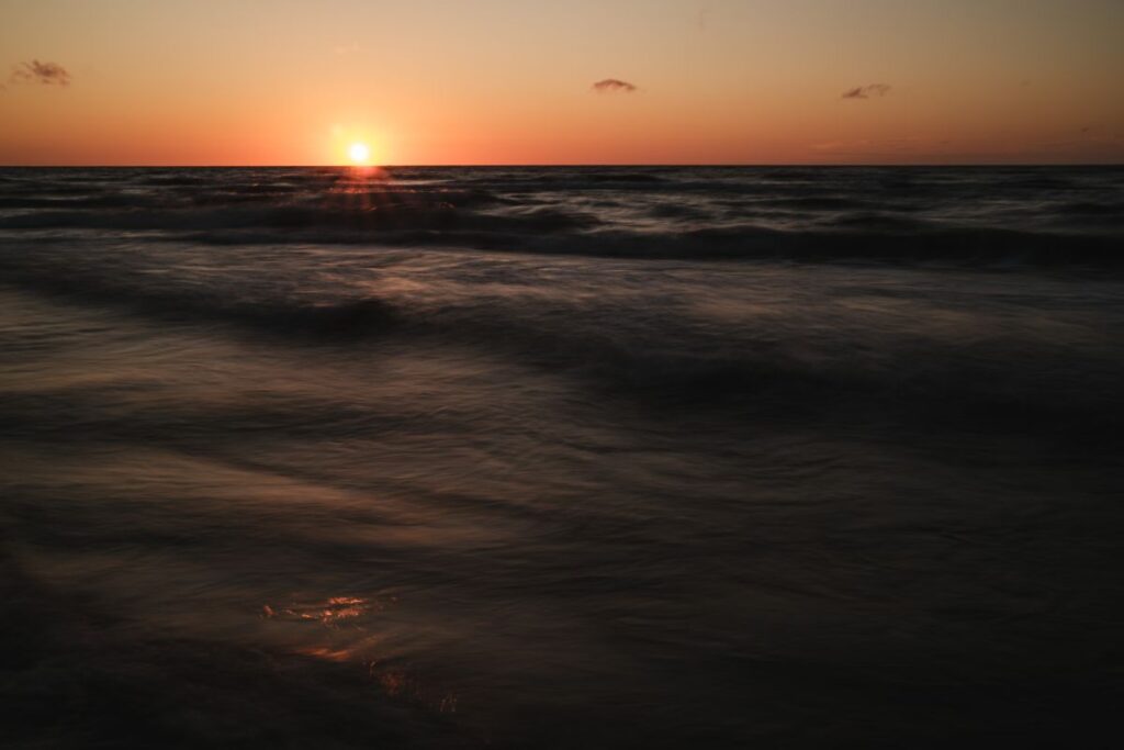 Sunset Reflections: A Tranquil Coastal Journey Stock Free