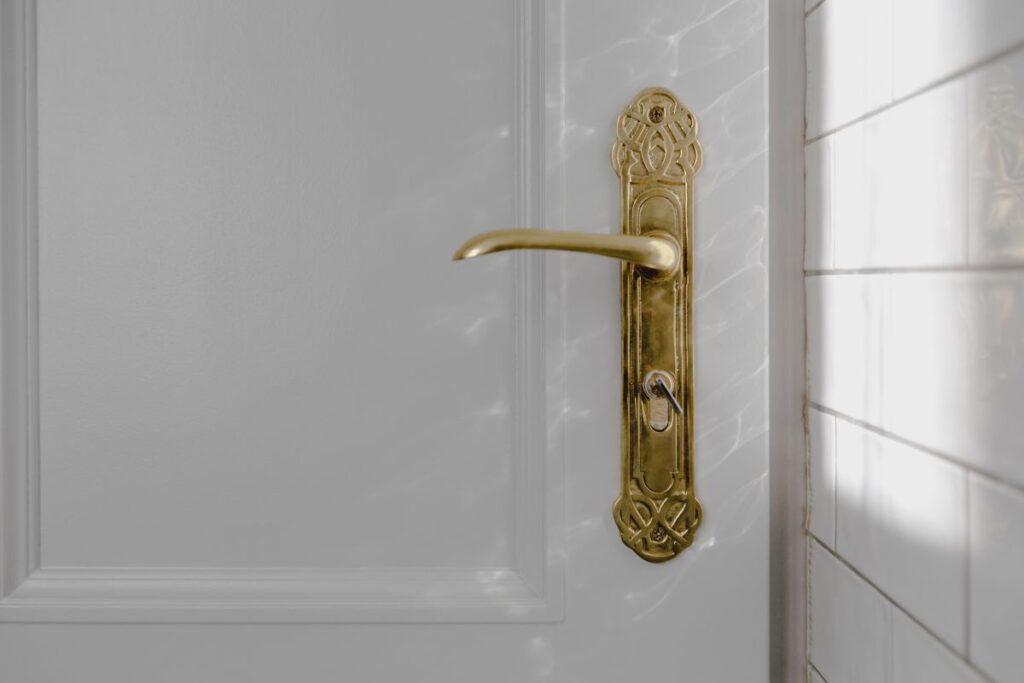 Antique gold plated door handle Stock Free