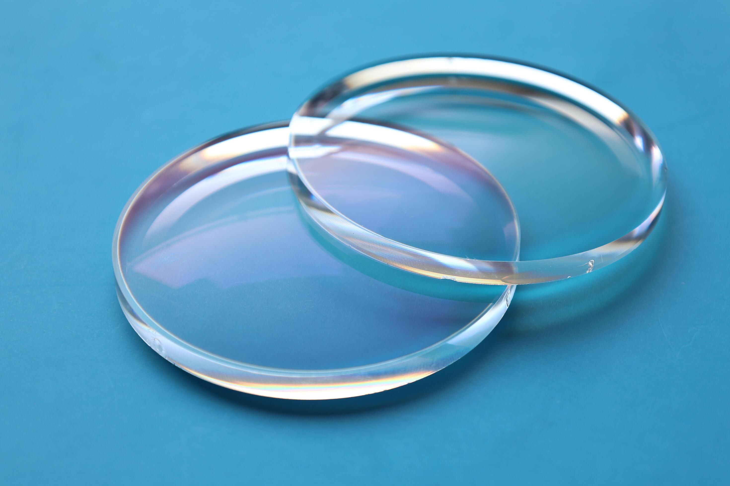 Eyeglasses lens production industry, close-up eyeglasses lenses, eyeglasses lenses, eyeglasses lenses, eyeglasses store business concept Stock Free