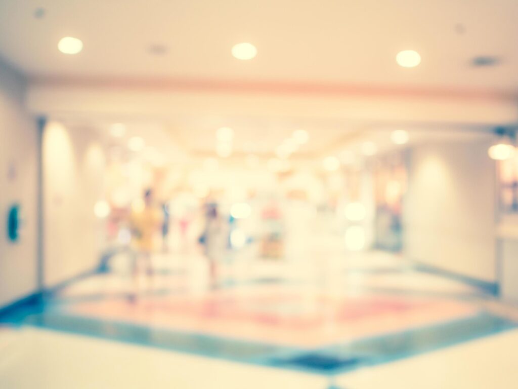 Blurred background, people at shopping mall blur background with bokeh and vintage tone. Stock Free