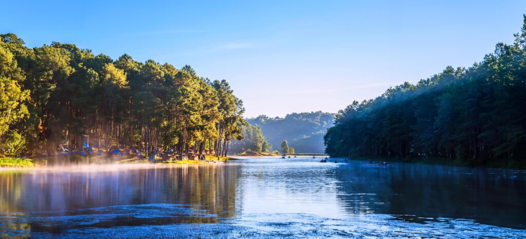 camping and travel Beatiful nature panorama view of Pang Ung lake in the mist at sunrise. Stock Free