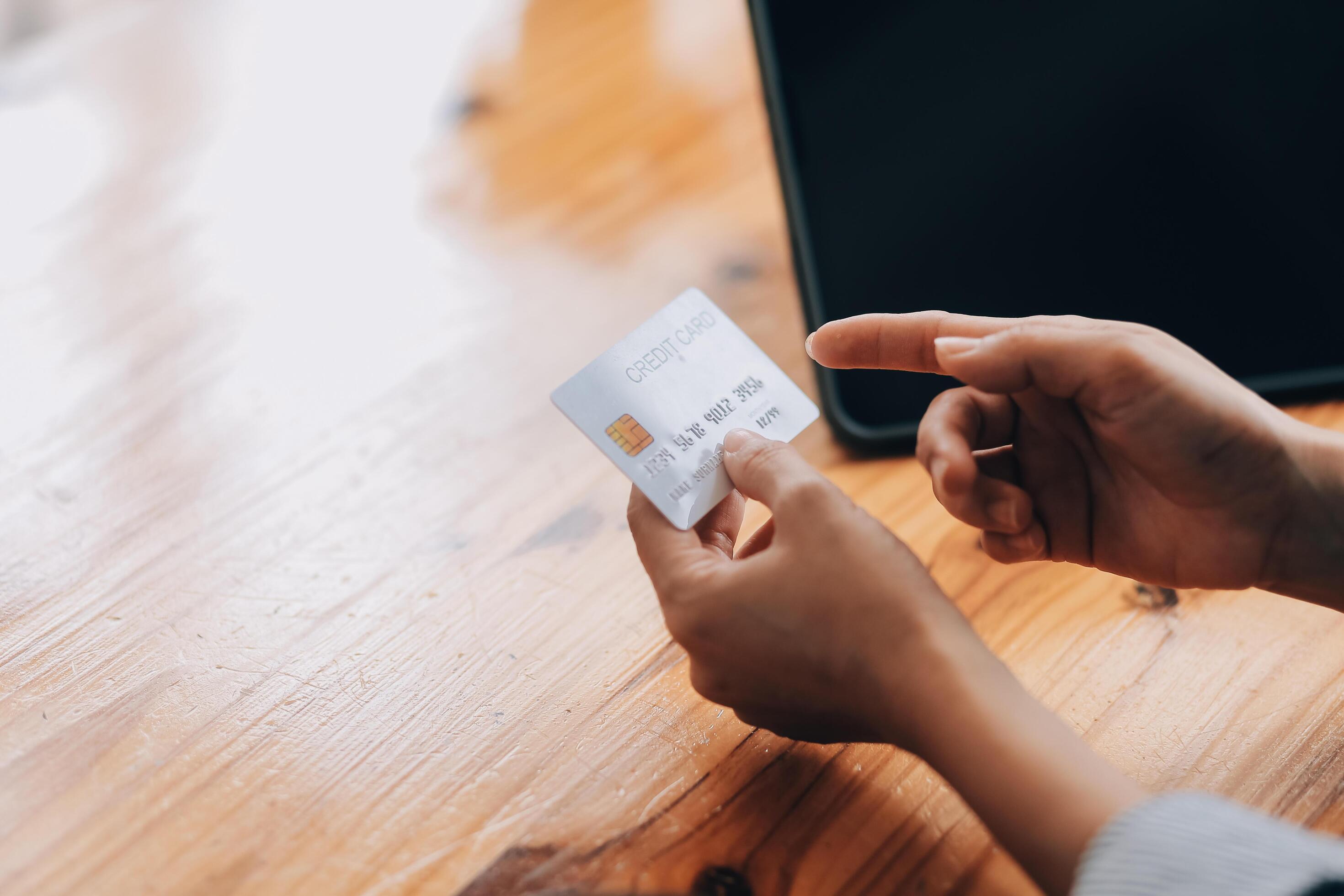 Happy asian woman using smartphone shopping online with credit card. Lifestyle. Easy pay using smart phone or digital device. Stock Free