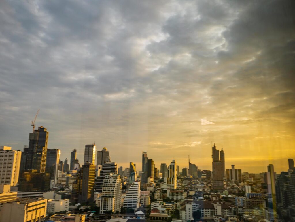 Bangkok city scape with orange sunset sky Stock Free