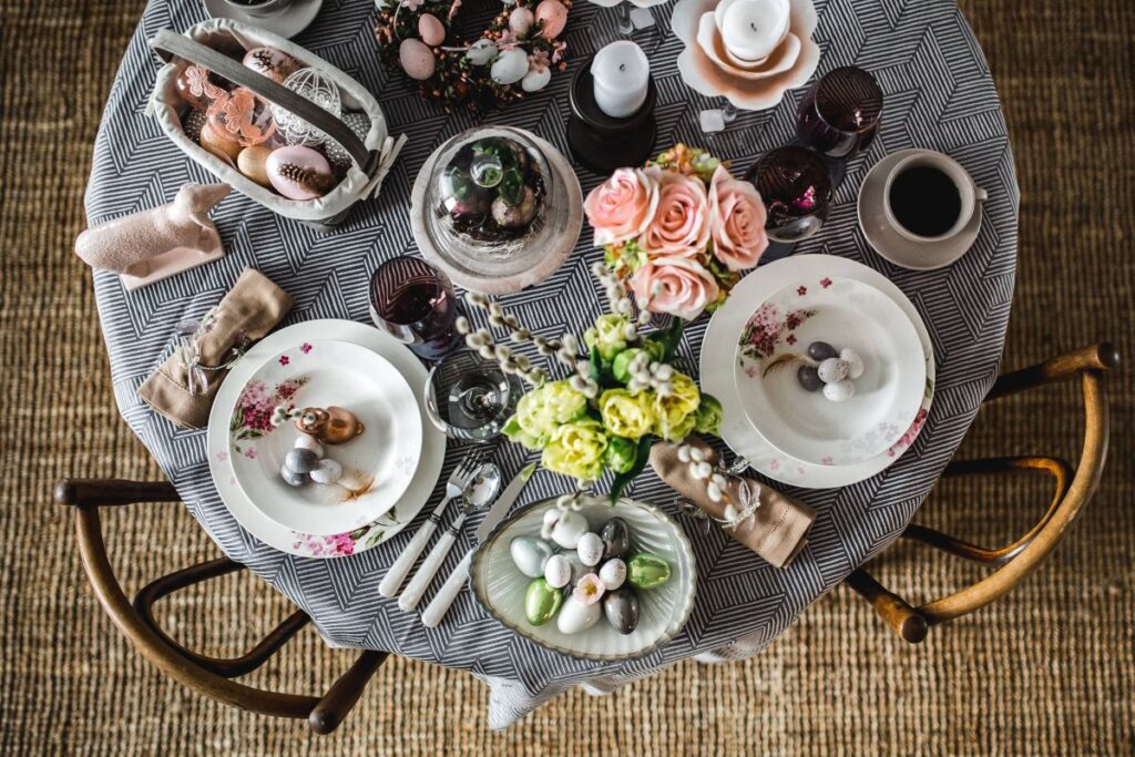 Round dinner table decorated with easter motifs Stock Free